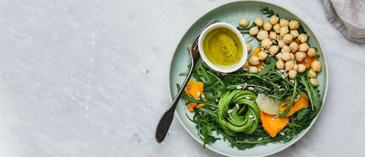 Healthy bowl of greens, avocados and chickpeas