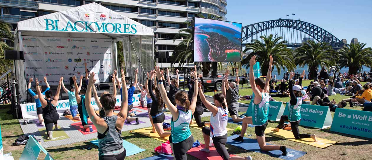 Runners doing yoga after the Blackmores Sydney Running Festival