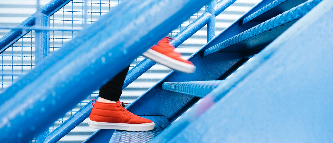 close up of shoes going up the stairs