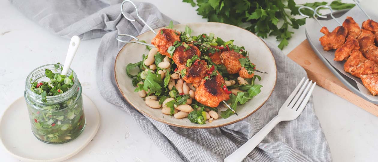 Chimichurri chicken skewers and white bean salad