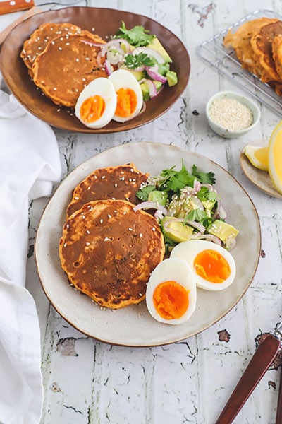 Kimchi fritters with soft boiled eggs and avocado salsa