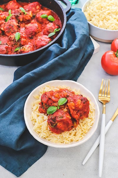 Juicy Italian baked meatballs in a rustic style sauce that is loaded with vegetables