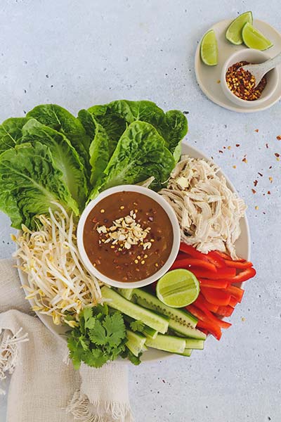 Shredded chicken and lettuce cups with satay sauce great for a share plate with family and friends