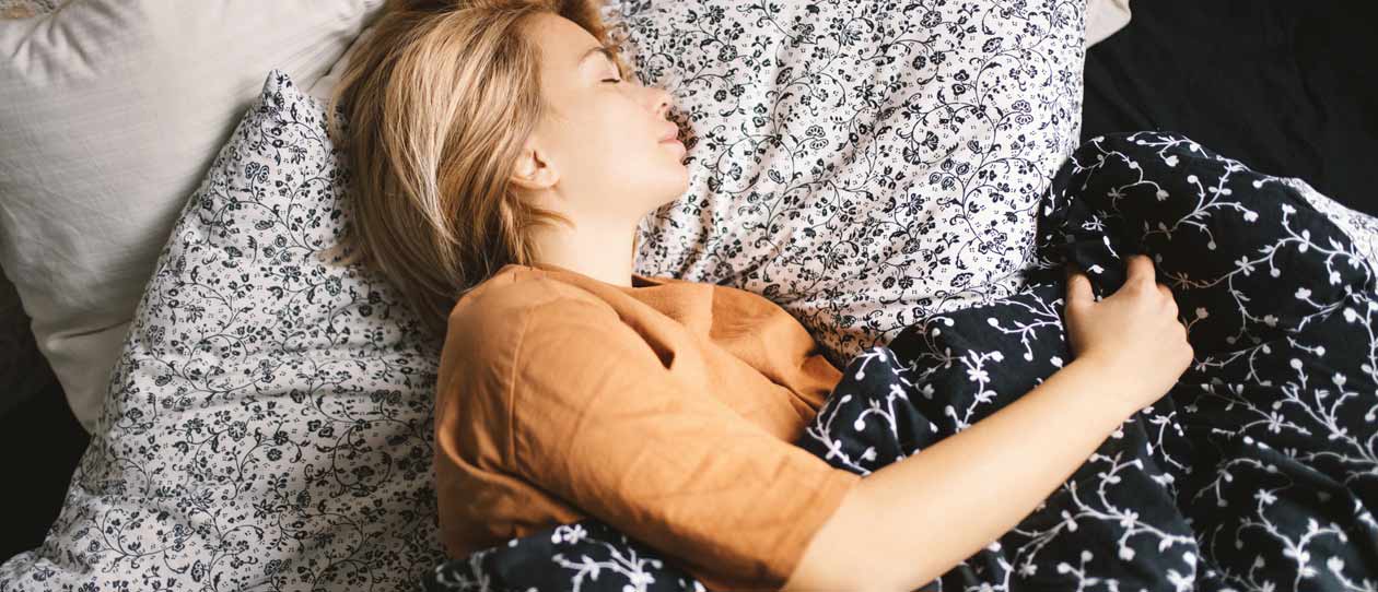 Woman asleep in bed