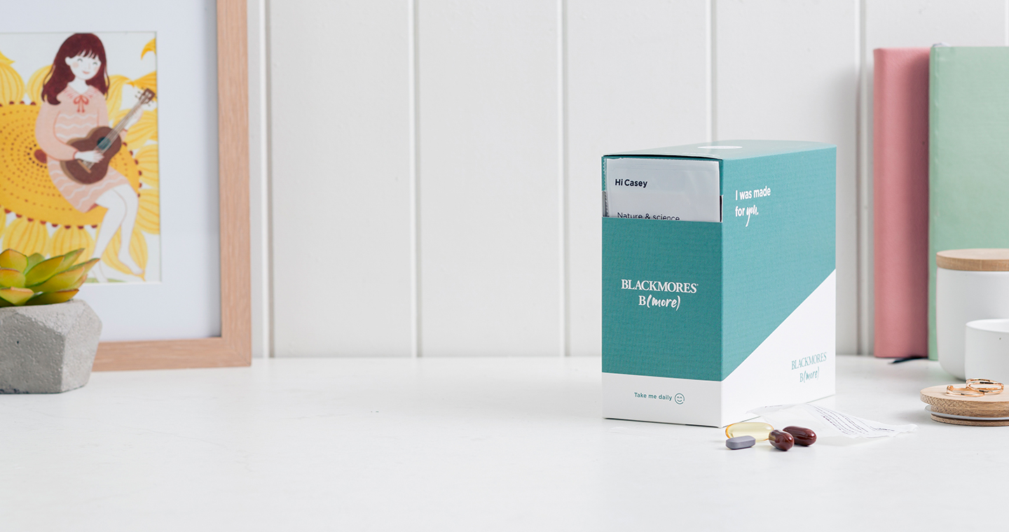 Blackmores B(more) Kit on a white table with the individual supplements sitting next to the box