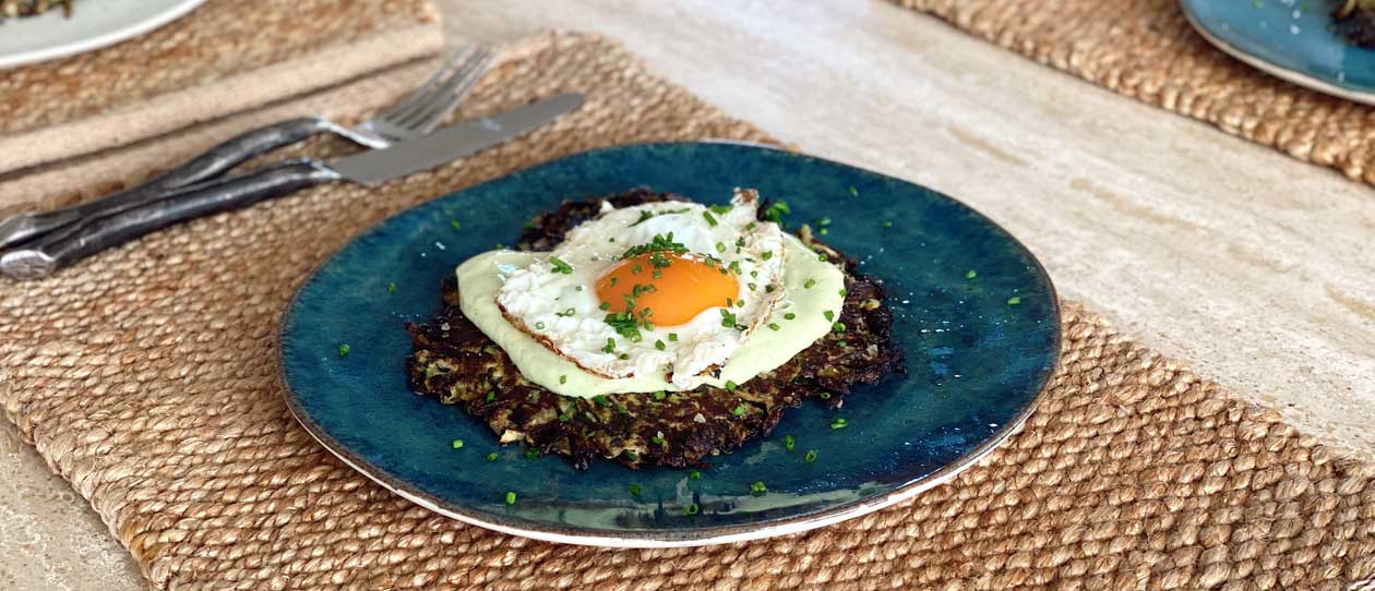 Gluten free zucchini fritters served with egg