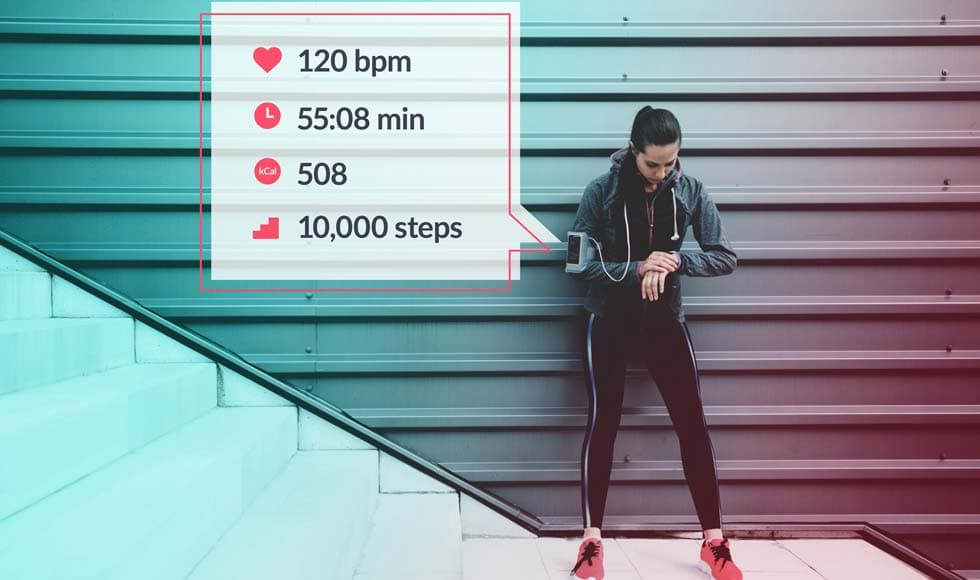 Woman checking her fitness stats on smart watch