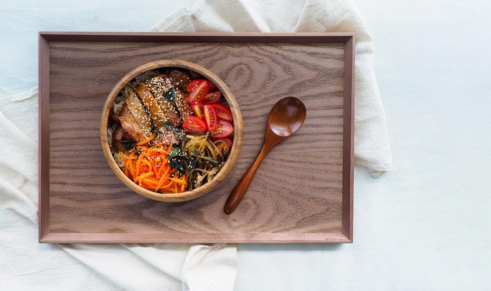 Bowl of vegetables, chicken and noodles on a tray