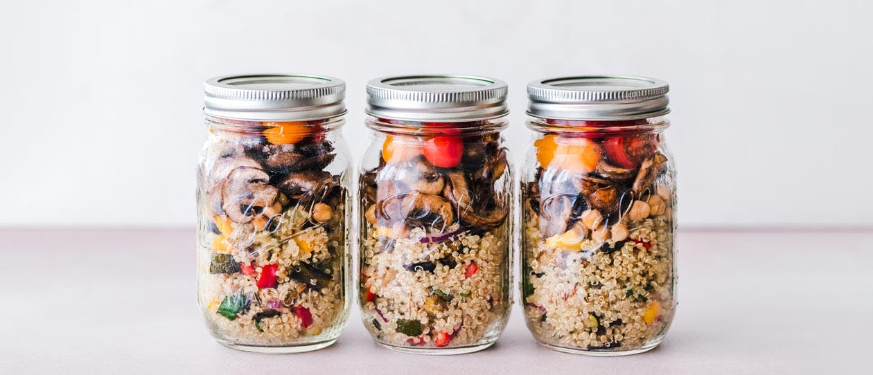 Three meal prep lunches in glass jars