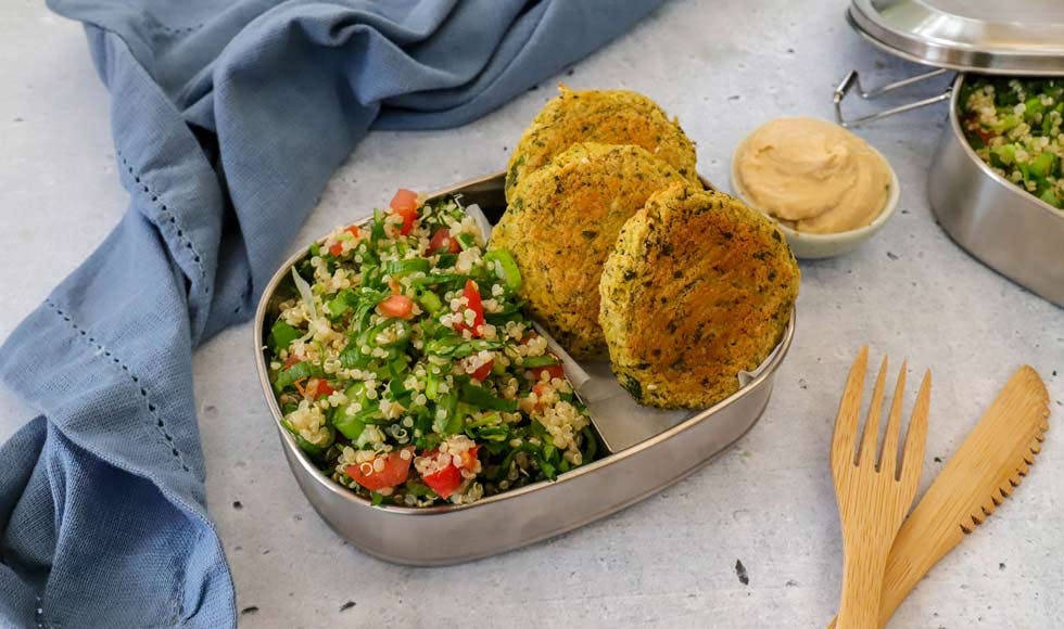 Falafel bites with quinoa tabouli & hummus in a metal lunchbox