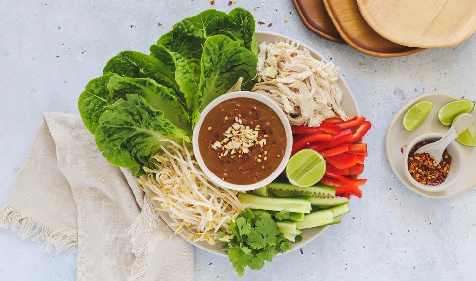 Shredded chicken lettuce cups with satay sauce
