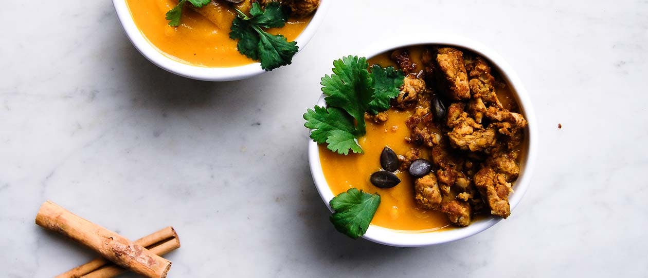 Spicy pumpkin soup with golden tempeh crumble