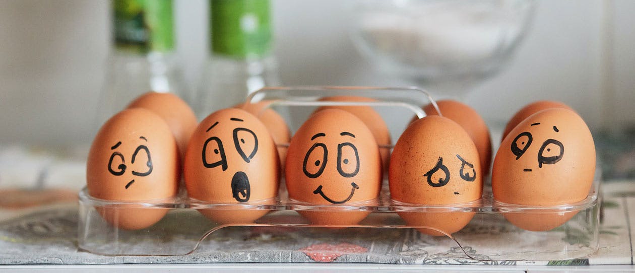 Painted eggs expressing a range of emotions from joy to sadness