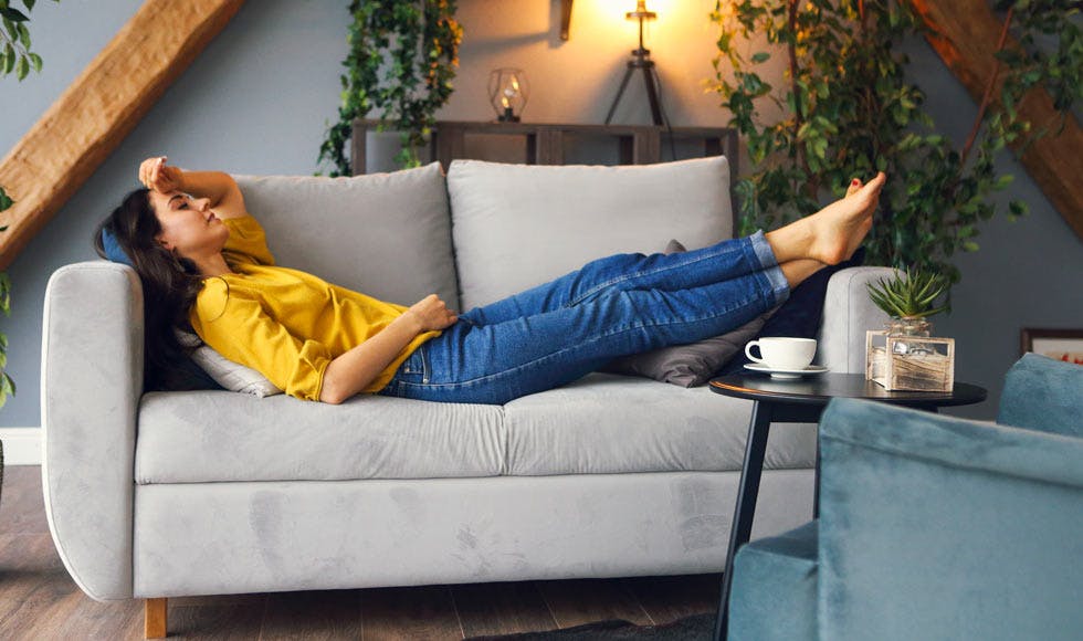 Young woman relaxing on the couch at home